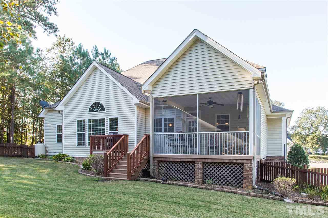 12 Vista Ridge Drive Willow Spring, NC 27592 - Photo 26 of 30 Take a look at the exterior back of this lovely home with a screened-in porch and grilling deck. Lot is well-manicured and landscaped.