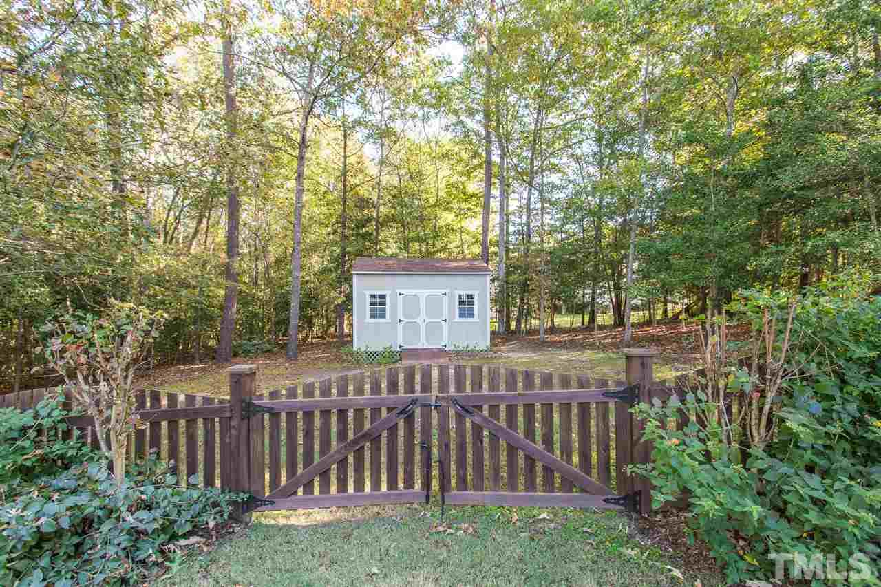 12 Vista Ridge Drive Willow Spring, NC 27592 - Photo 28 of 30 A storage shed is provided for your convenience.