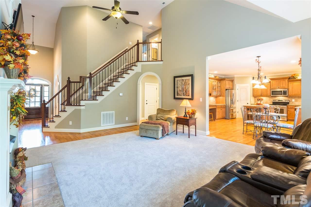 12 Vista Ridge Drive Willow Spring, NC 27592 - Photo 7 of 30 This beautiful staircase with wrought iron pickets overlooks the spacious family room which features new carpet, built-in shelving and a gas log fireplace.