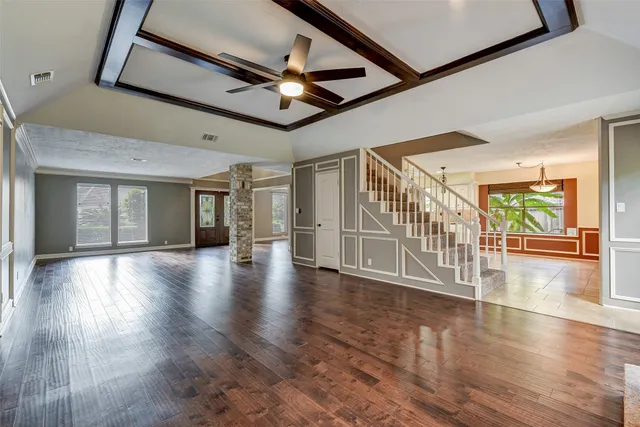 a view of an entryway with wooden floor