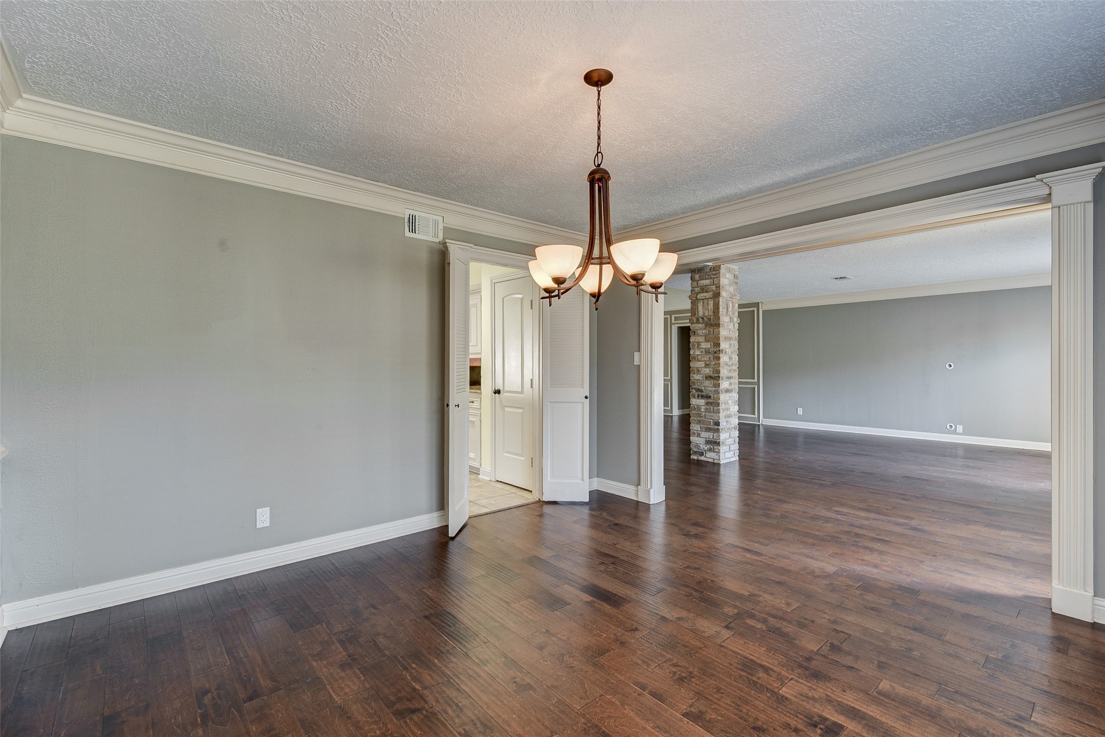 18310 Lake Oaks Drive Spring, TX 77388 - Photo 15 of 31 a view of a room with wooden floor chandelier and closet