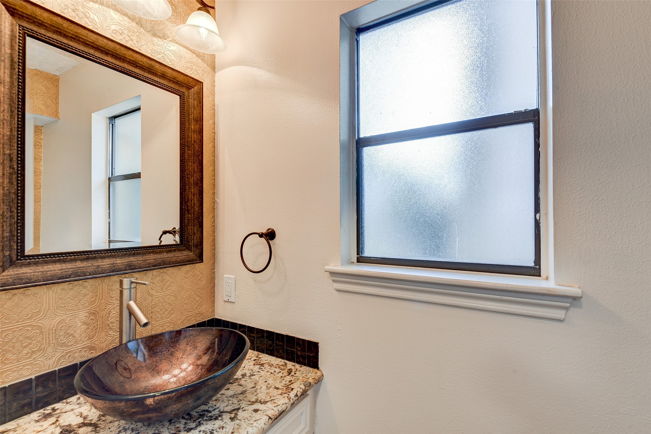18310 Lake Oaks Drive Spring, TX 77388 - Photo 17 of 31 a bathroom with a sink and a mirror