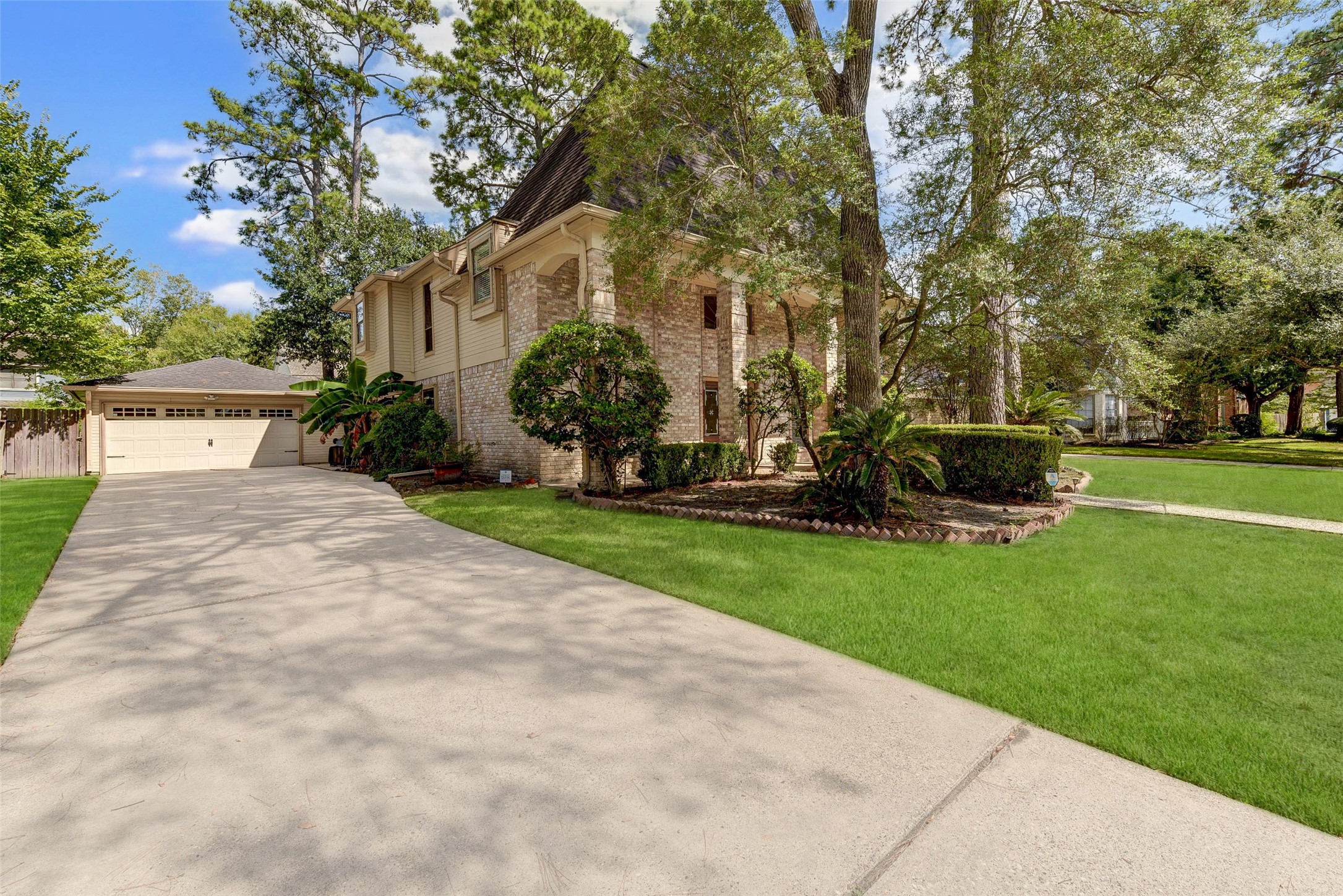 18310 Lake Oaks Drive Spring, TX 77388 - Photo 4 of 31 a view of a yard with plants and trees