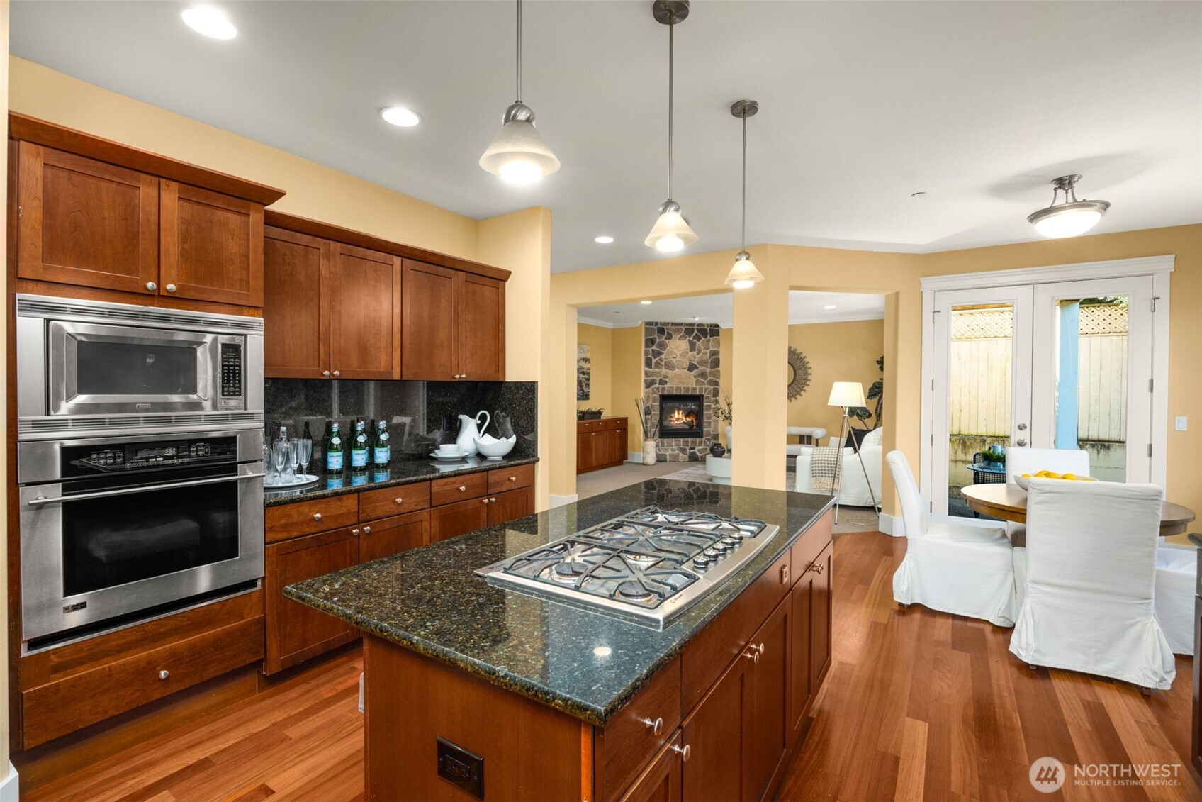 18638 92nd Avenue Northeast Bothell, WA 98011 - Photo 15 of 40 a kitchen with a stove and a wooden floor