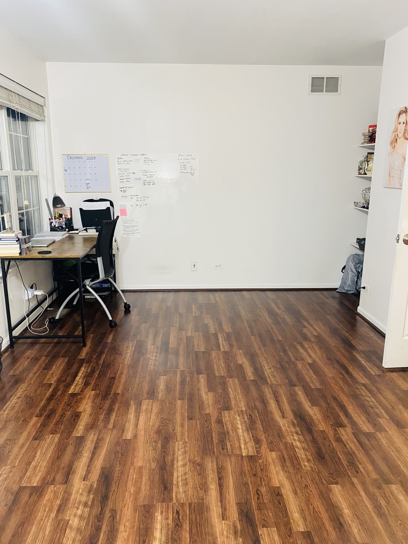 2745 Borkshire Lane, Unit 2745 Aurora, IL 60502 - Photo 12 of 23 a workspace with wooden floor