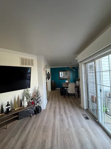 a living room with furniture and flowers