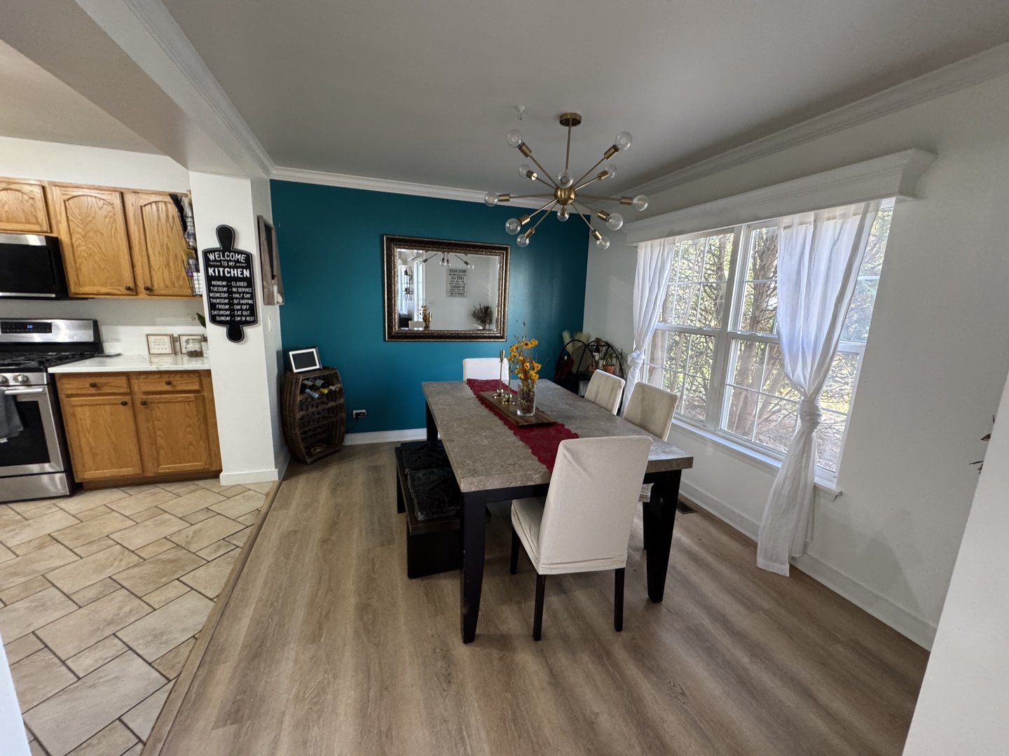 2745 Borkshire Lane, Unit 2745 Aurora, IL 60502 - Photo 20 of 23 a view of a dining room with furniture a rug and wooden floor