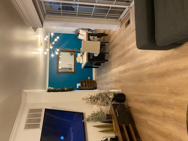 a kitchen with stainless steel appliances kitchen island granite countertop a sink refrigerator stove and microwave