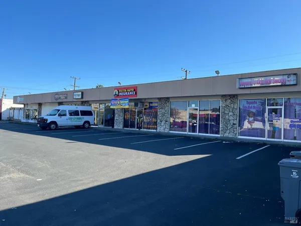 a front view of a building with street view