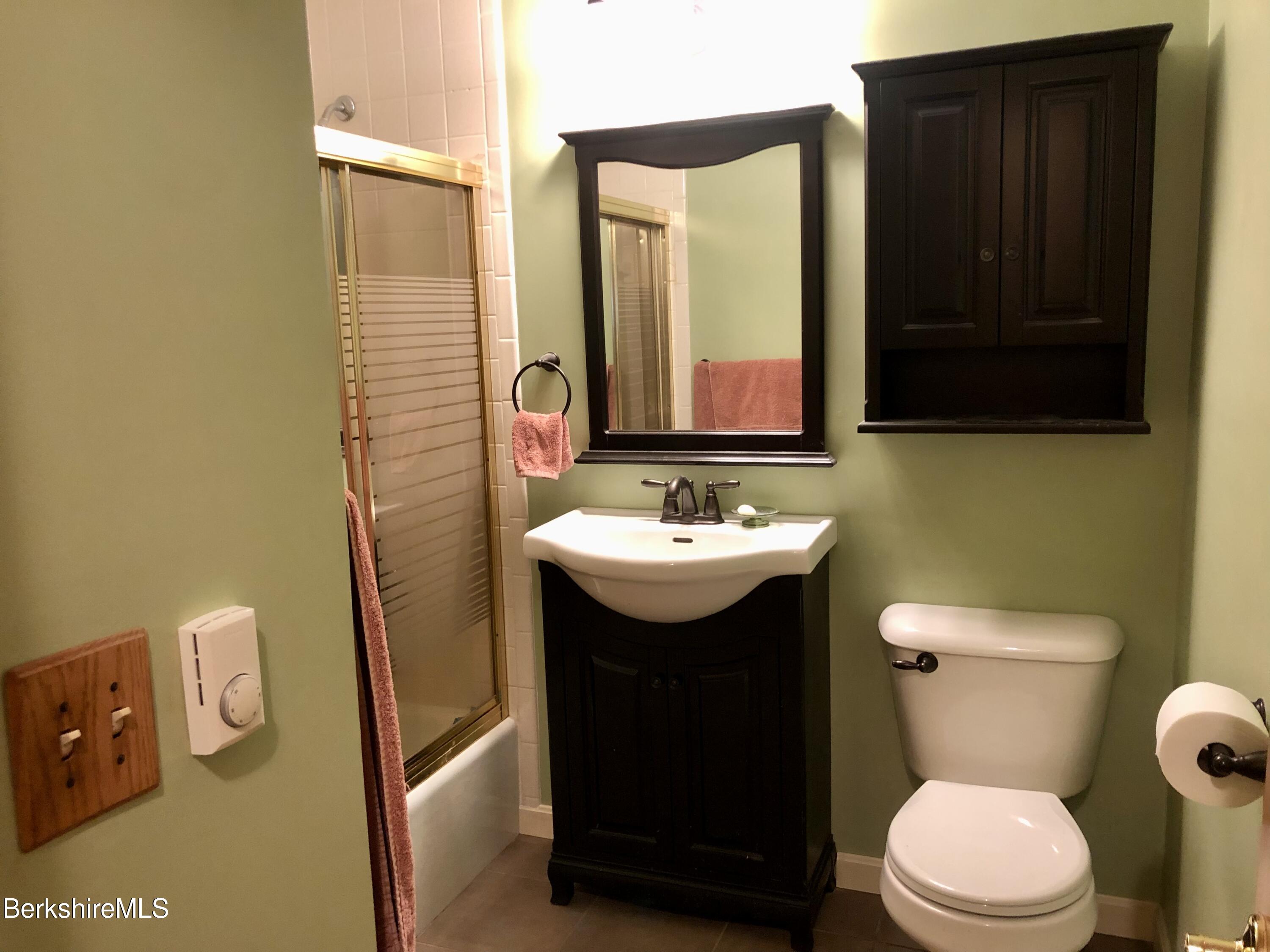 95 Bruce Drive Dalton, MA 01226 - Photo 12 of 30 a bathroom with a sink a toilet and mirror
