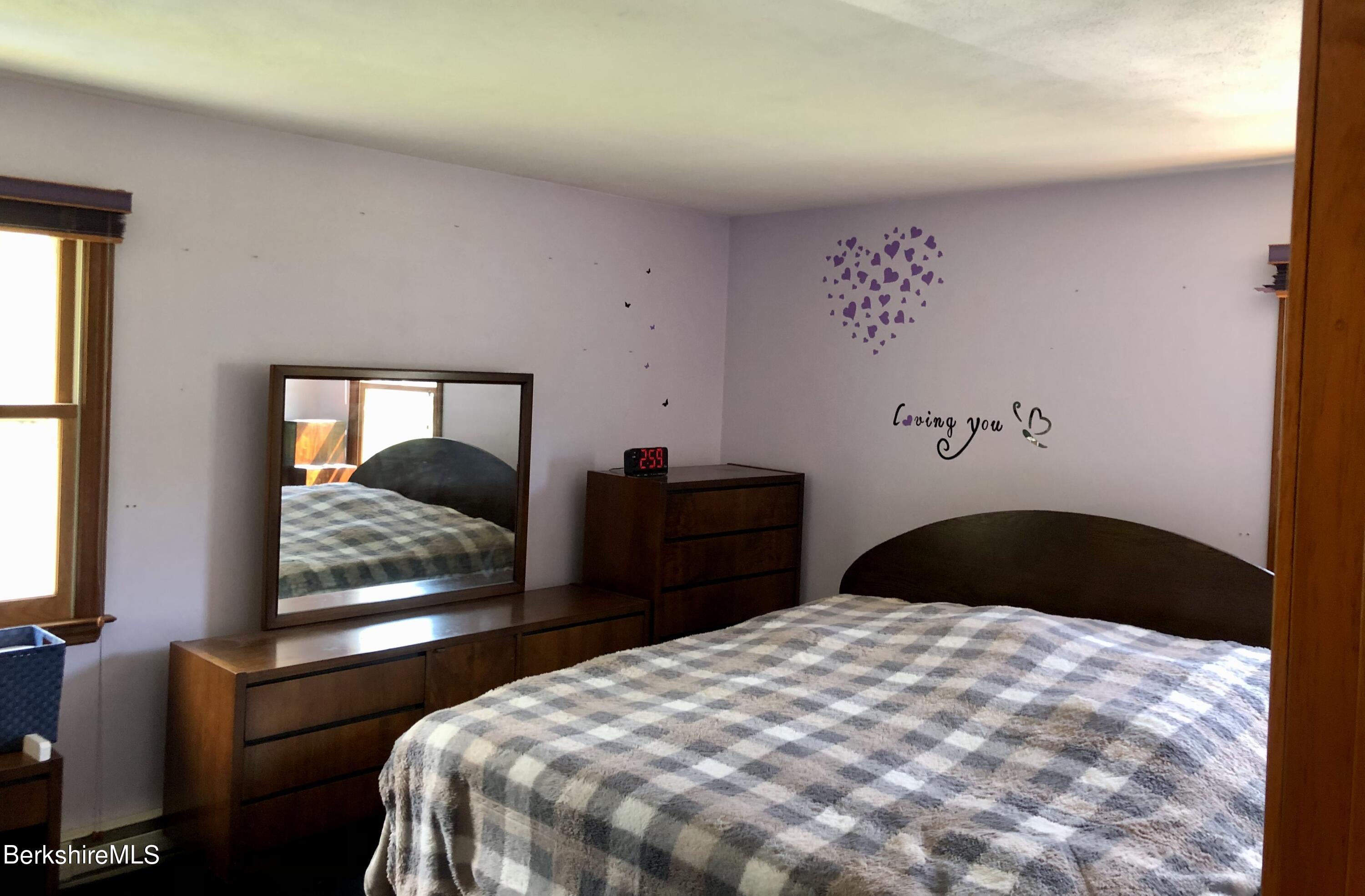 95 Bruce Drive Dalton, MA 01226 - Photo 14 of 30 a bedroom with a bed and dresser with mirror