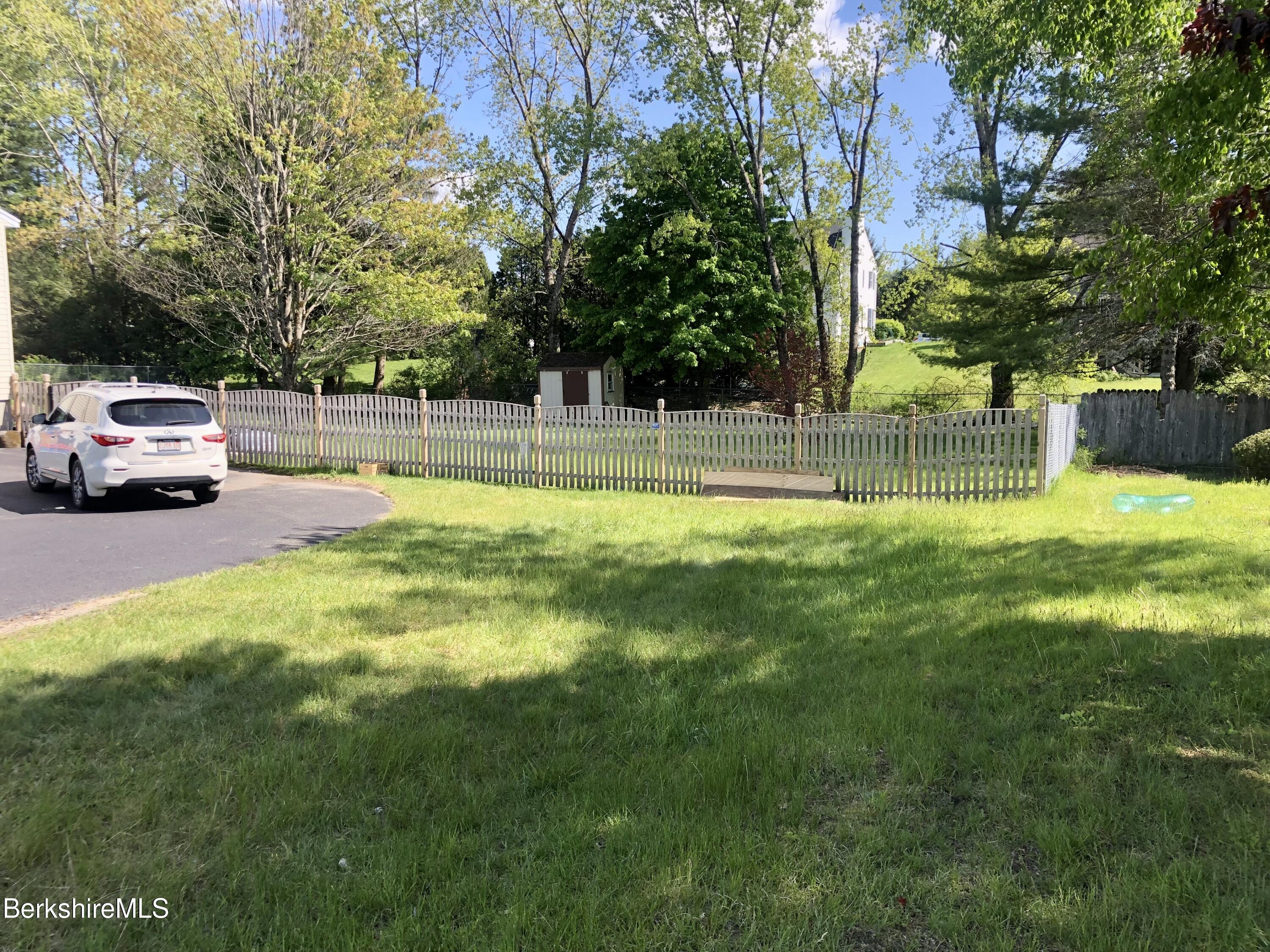 95 Bruce Drive Dalton, MA 01226 - Photo 27 of 30 a swimming pool with lots of trees and plants