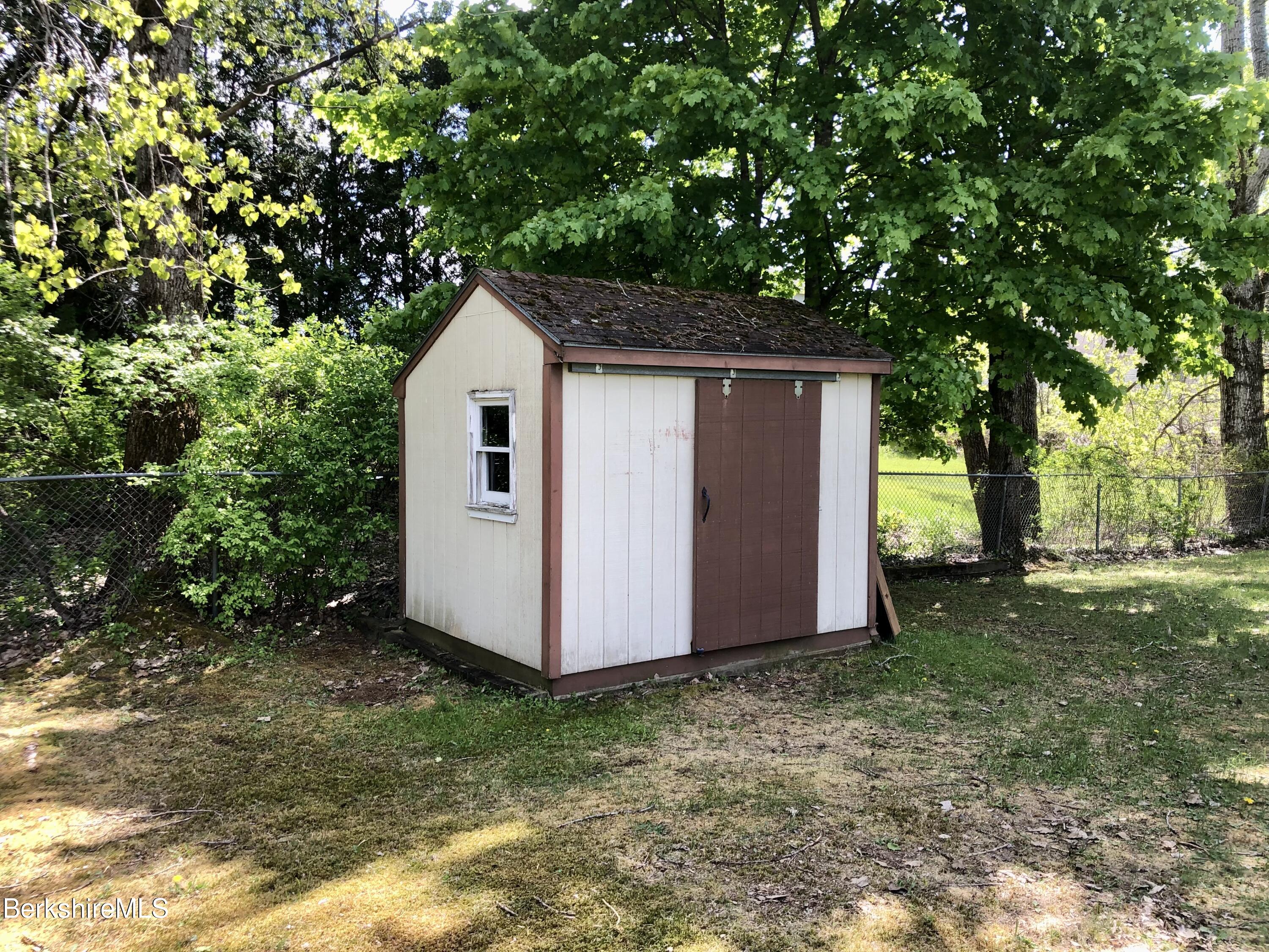 95 Bruce Drive Dalton, MA 01226 - Photo 29 of 30 a view of backyard with large trees and wooden fence
