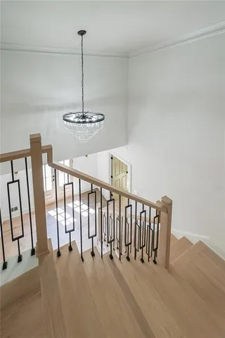 a view of a room with lots of furniture and windows