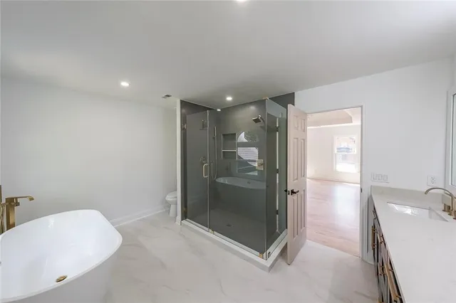 a bathroom with a shower and a bathtub