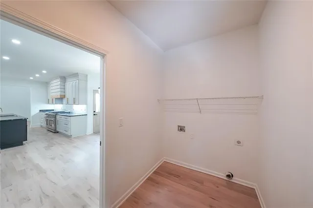a view of a storage & utility room with a sink