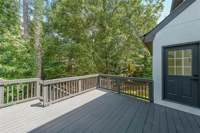 a view of balcony with wooden floor