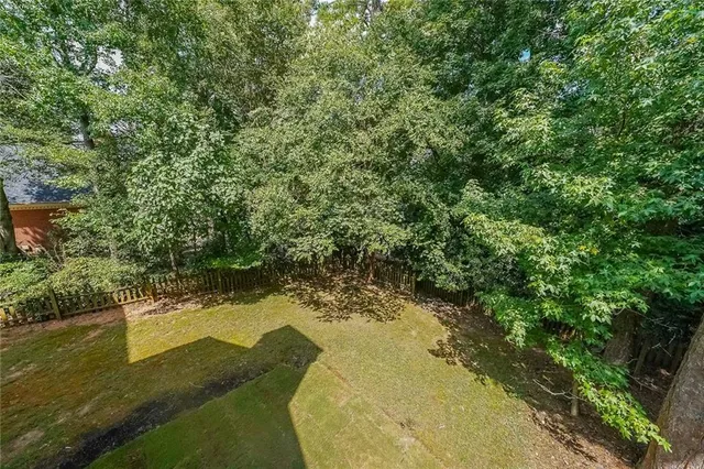 a view of swimming pool from a yard
