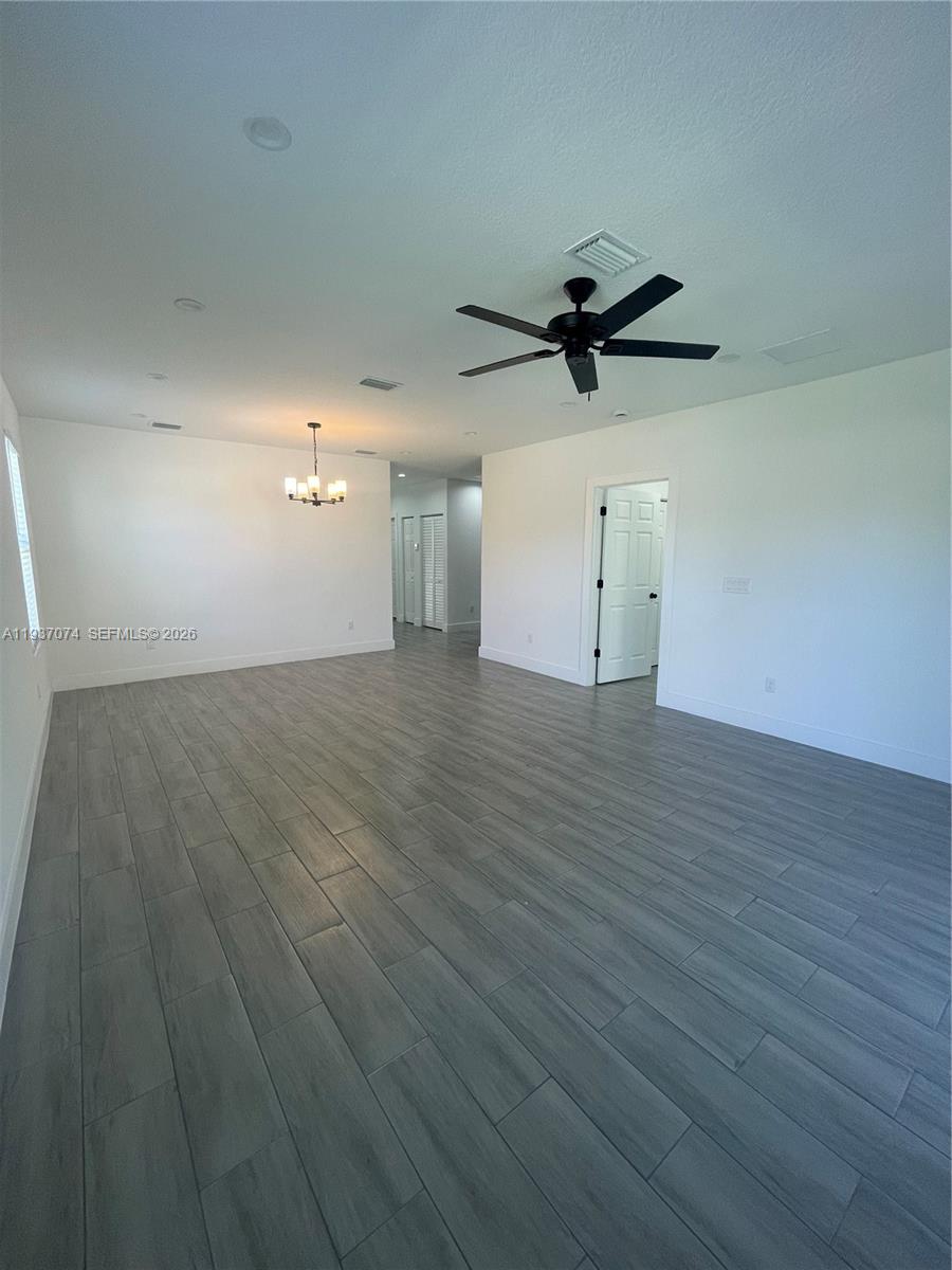 912 West 10th Street Riviera Beach, FL 33404 - Photo 17 of 24 wooden floor in an empty room