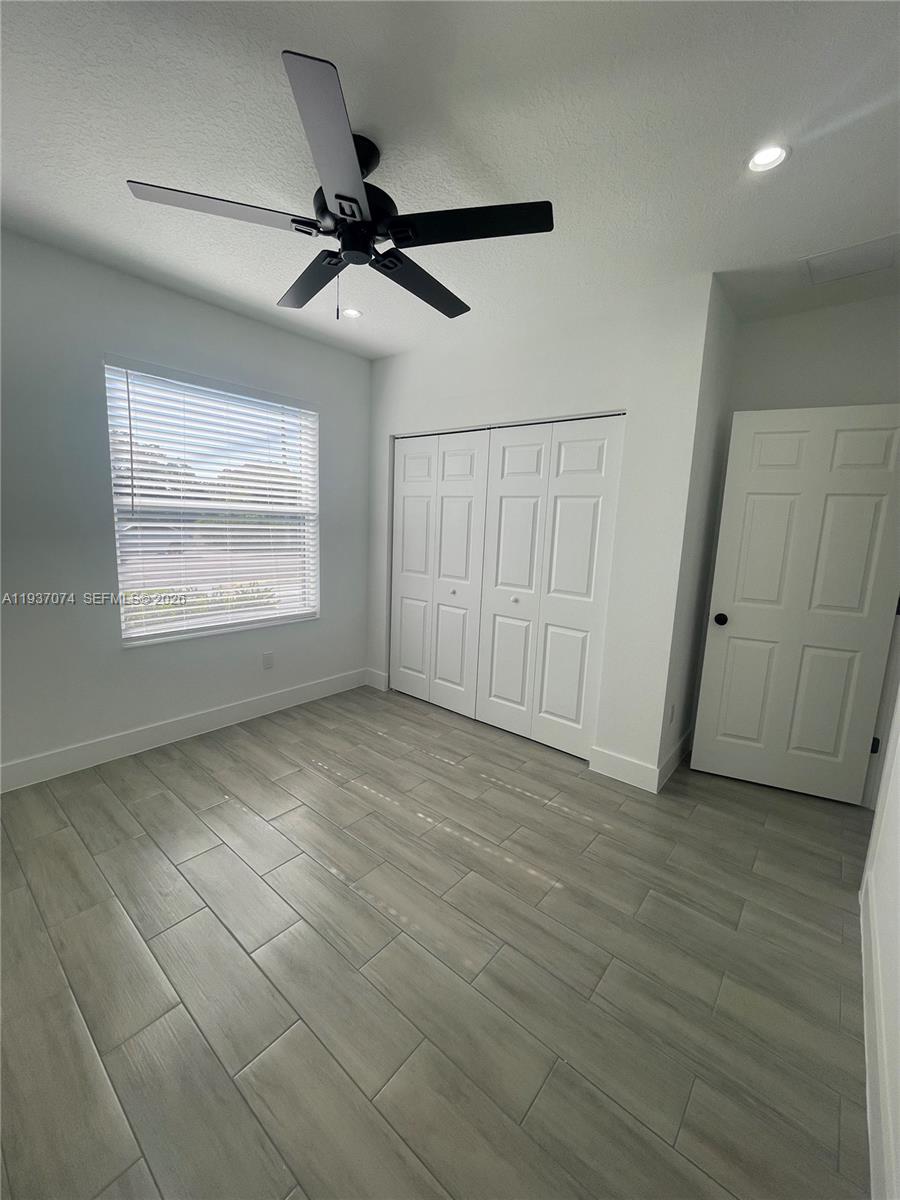 912 West 10th Street Riviera Beach, FL 33404 - Photo 7 of 24 a view of an empty room with a window