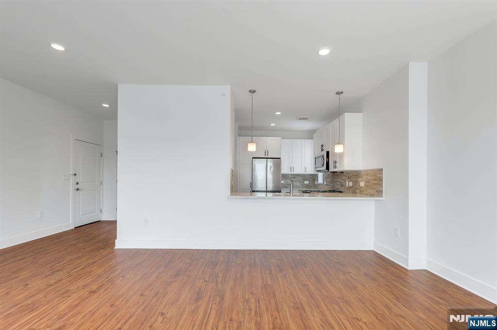 85 Ridge Road, Unit 111 North Arlington, NJ 07031 - Photo 18 of 27 a view of kitchen with wooden floor