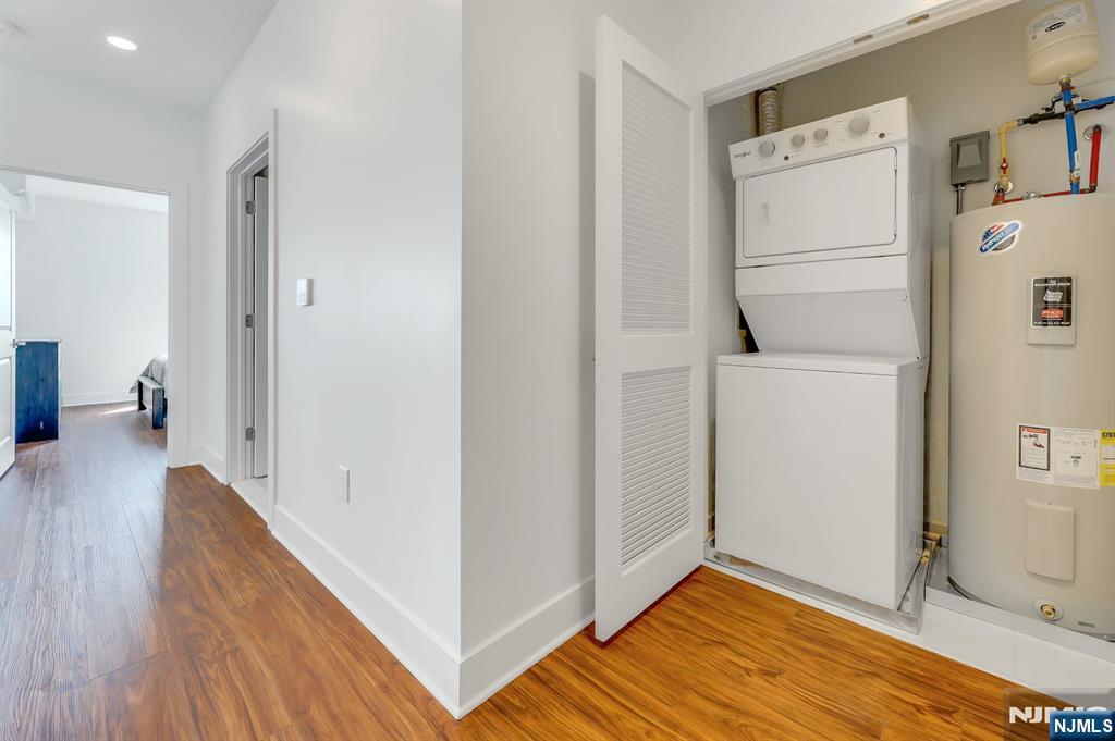 85 Ridge Road, Unit 111 North Arlington, NJ 07031 - Photo 19 of 27 a view of a kitchen with refrigerator and wooden floor