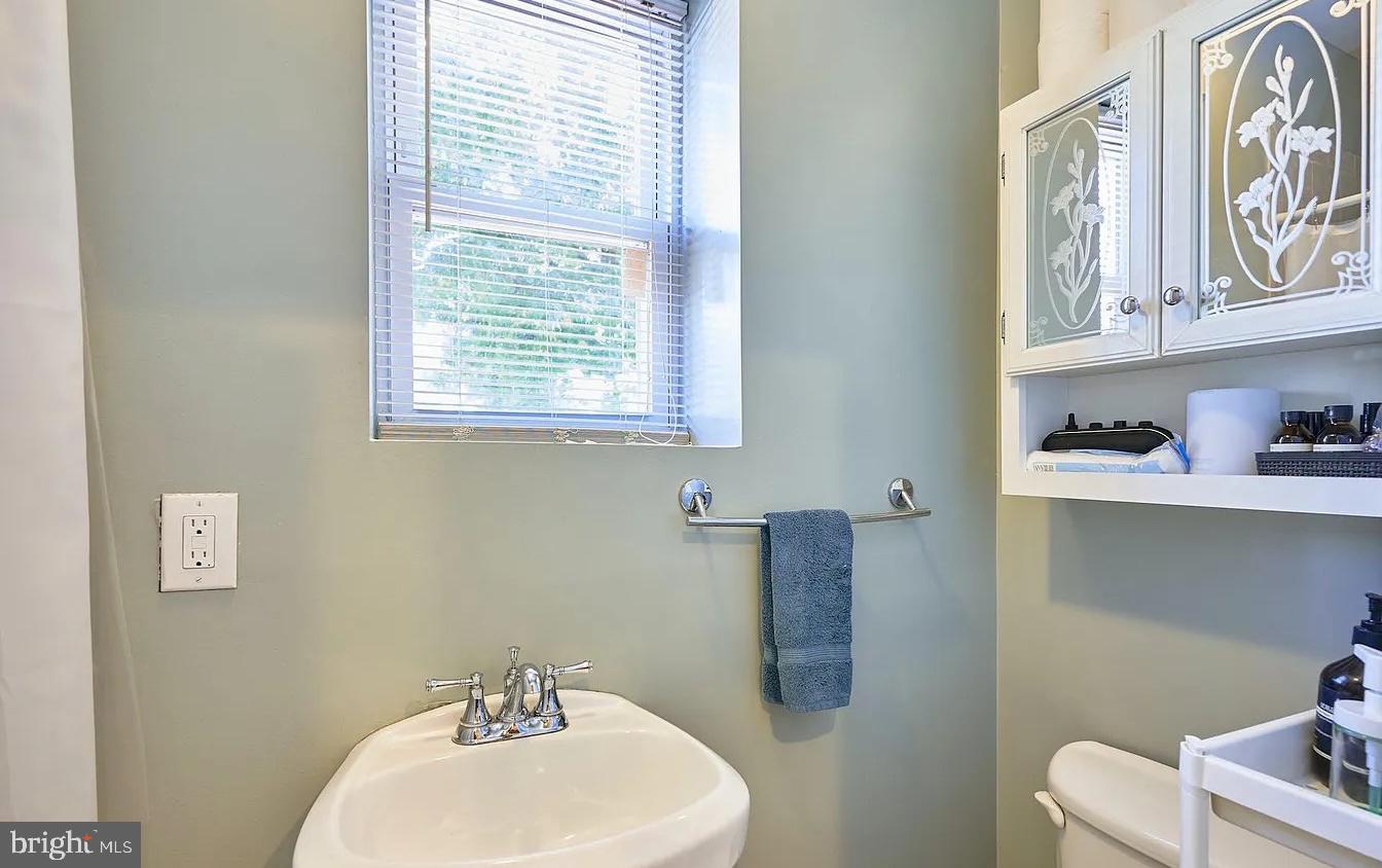 500 Florida Avenue Northwest, Unit 1 Washington, DC 20001 - Photo 11 of 20 a bathroom with a sink a toilet and a window