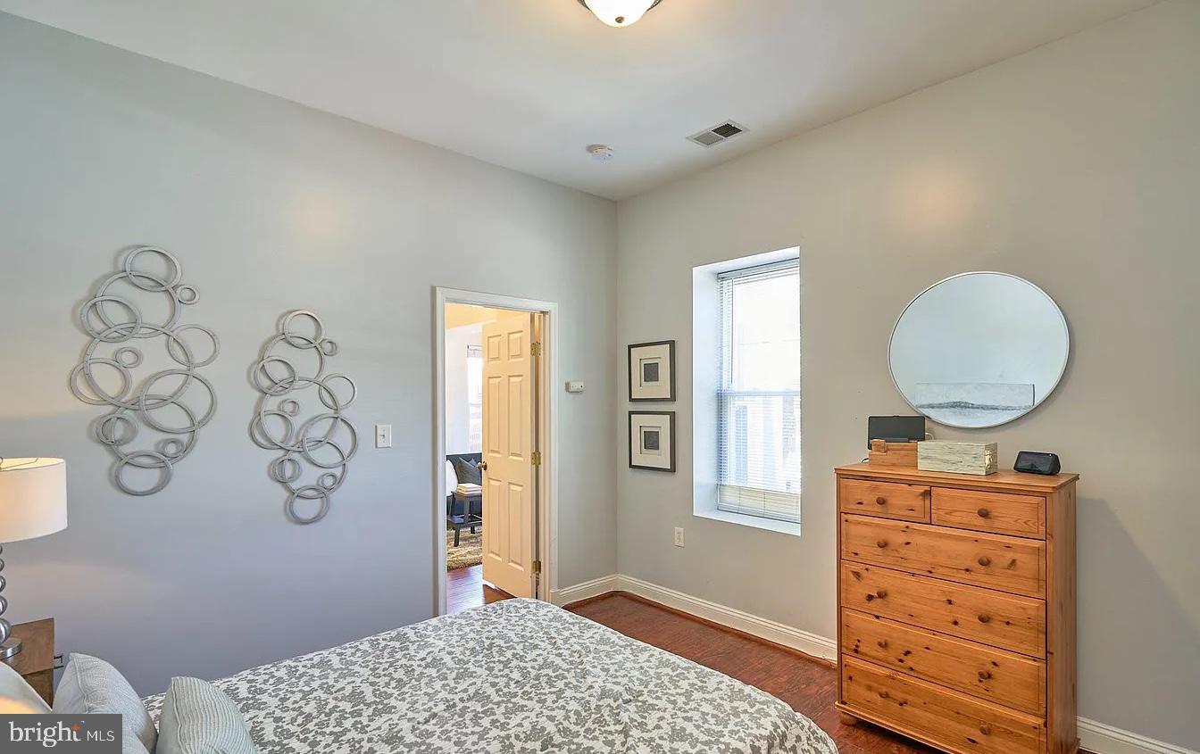 500 Florida Avenue Northwest, Unit 1 Washington, DC 20001 - Photo 14 of 20 a bedroom with a bed and a window