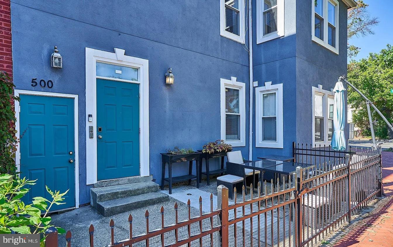 500 Florida Avenue Northwest, Unit 1 Washington, DC 20001 - Photo 17 of 20 a view of a house with large windows and furniture