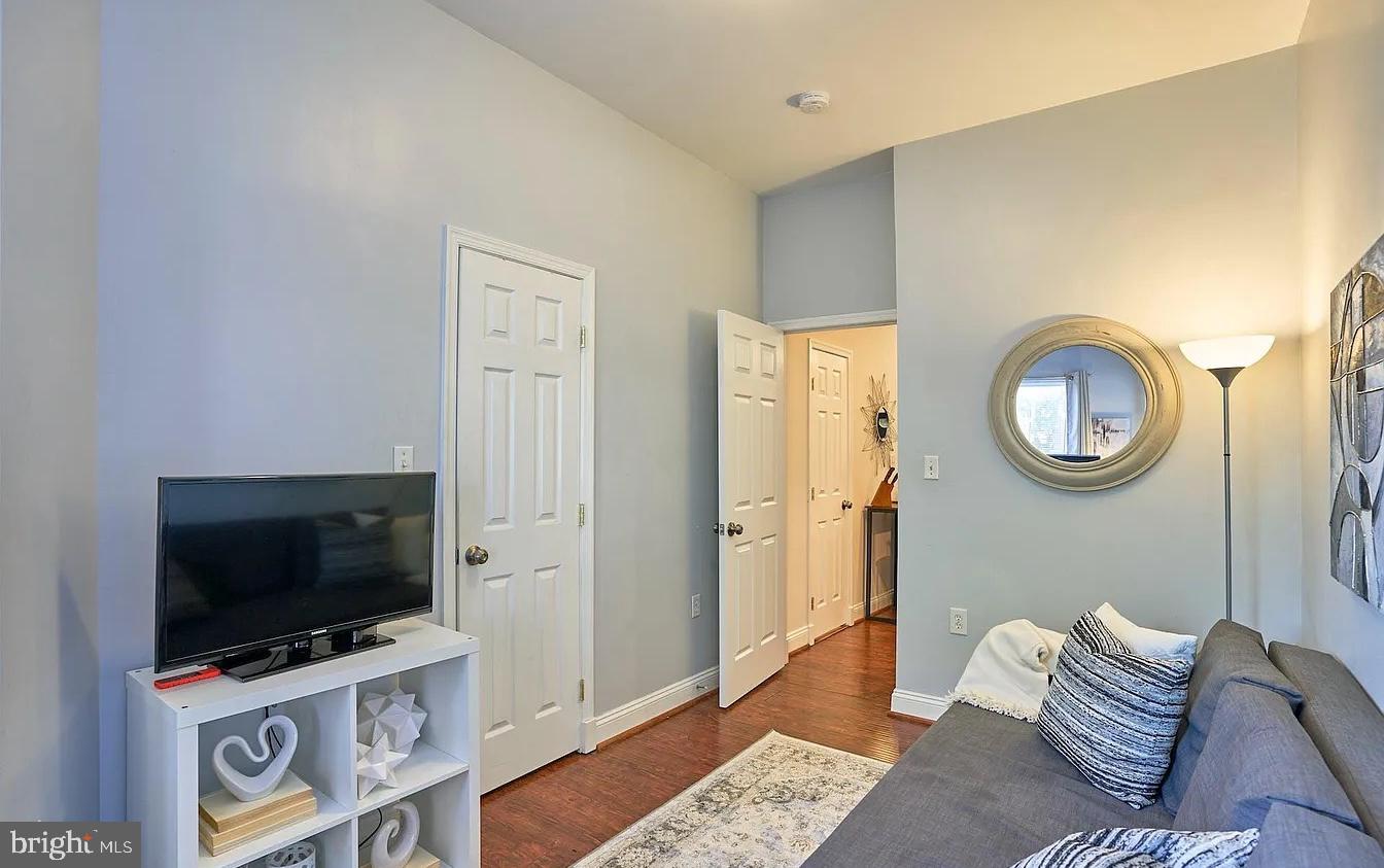 500 Florida Avenue Northwest, Unit 1 Washington, DC 20001 - Photo 4 of 20 a living room with furniture and a flat screen tv