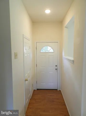 an empty room with wooden door