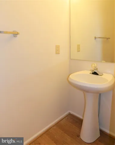 a bathroom with a sink and mirror