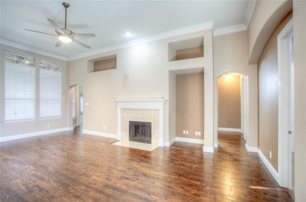 1122 Bridgeway Lane Allen, TX 75013 - Photo 2 of 22 a view of an empty room with window and fire place