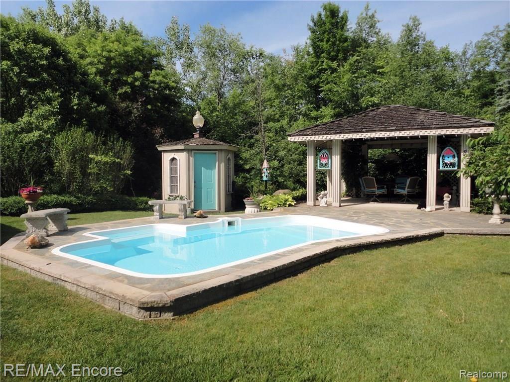 6435 Lahring Road Holly, MI 48442 - Photo 31 of 53 Pool with covered porch and half bath.jpg
