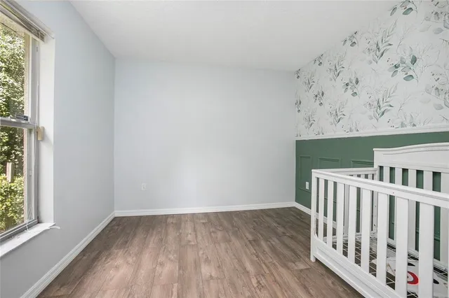 a view of wooden floor with a window