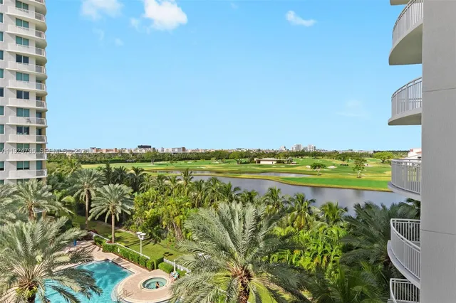 a view of a lake with a building in the background