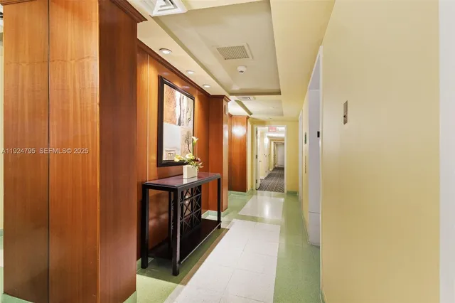 a view of a hallway with a large mirror