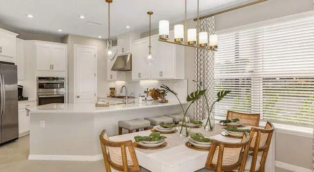 a en suite bathroom with sinks mirror and view