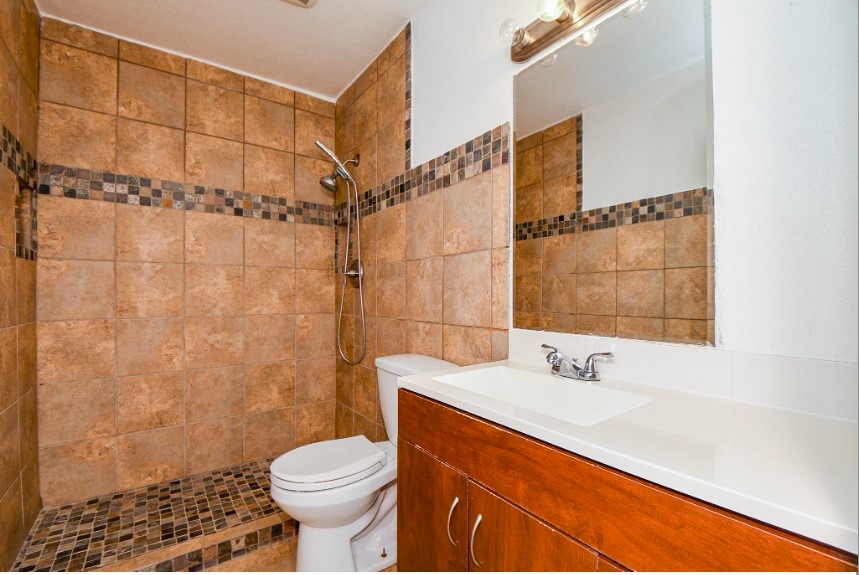 7233 Beechnut Street, Unit A Houston, TX 77074 - Photo 25 of 40 a bathroom with a sink toilet and shower