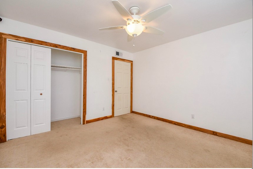 7233 Beechnut Street, Unit A Houston, TX 77074 - Photo 27 of 40 an empty room with a ceiling fan and a window