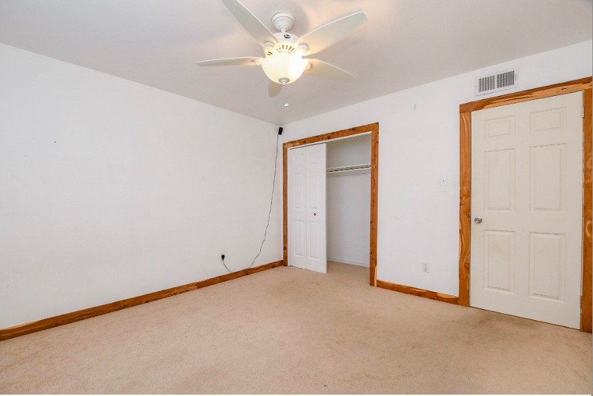 7233 Beechnut Street, Unit A Houston, TX 77074 - Photo 28 of 40 an empty room with a ceiling fan and a window
