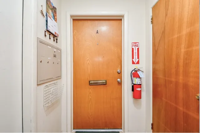 a bathroom with a shower and a door