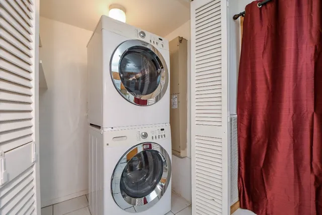 a view of a hallway with washer and dryer