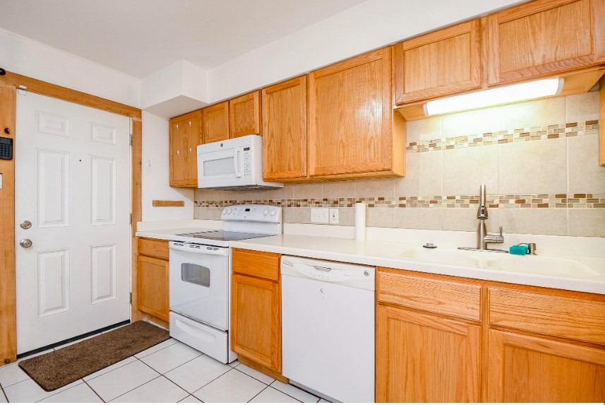 7233 Beechnut Street, Unit A Houston, TX 77074 - Photo 33 of 40 a kitchen with stainless steel appliances granite countertop a sink and cabinets