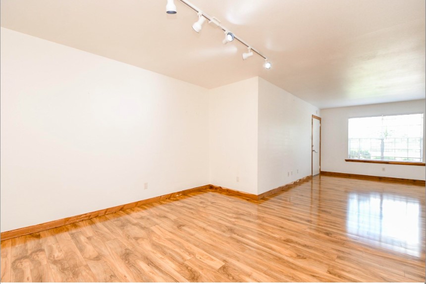 7233 Beechnut Street, Unit A Houston, TX 77074 - Photo 7 of 40 a view of empty room with wooden floor and fan