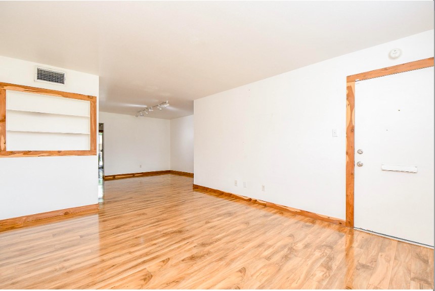 7233 Beechnut Street, Unit A Houston, TX 77074 - Photo 9 of 40 a view of empty room with wooden floor