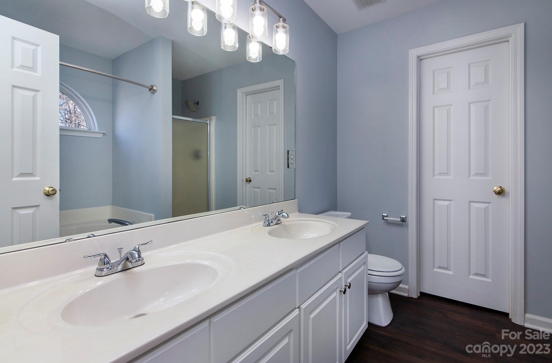 6112 Nevin Road Charlotte, NC 28262 - Photo 15 of 23 a bathroom with a sink and a mirror