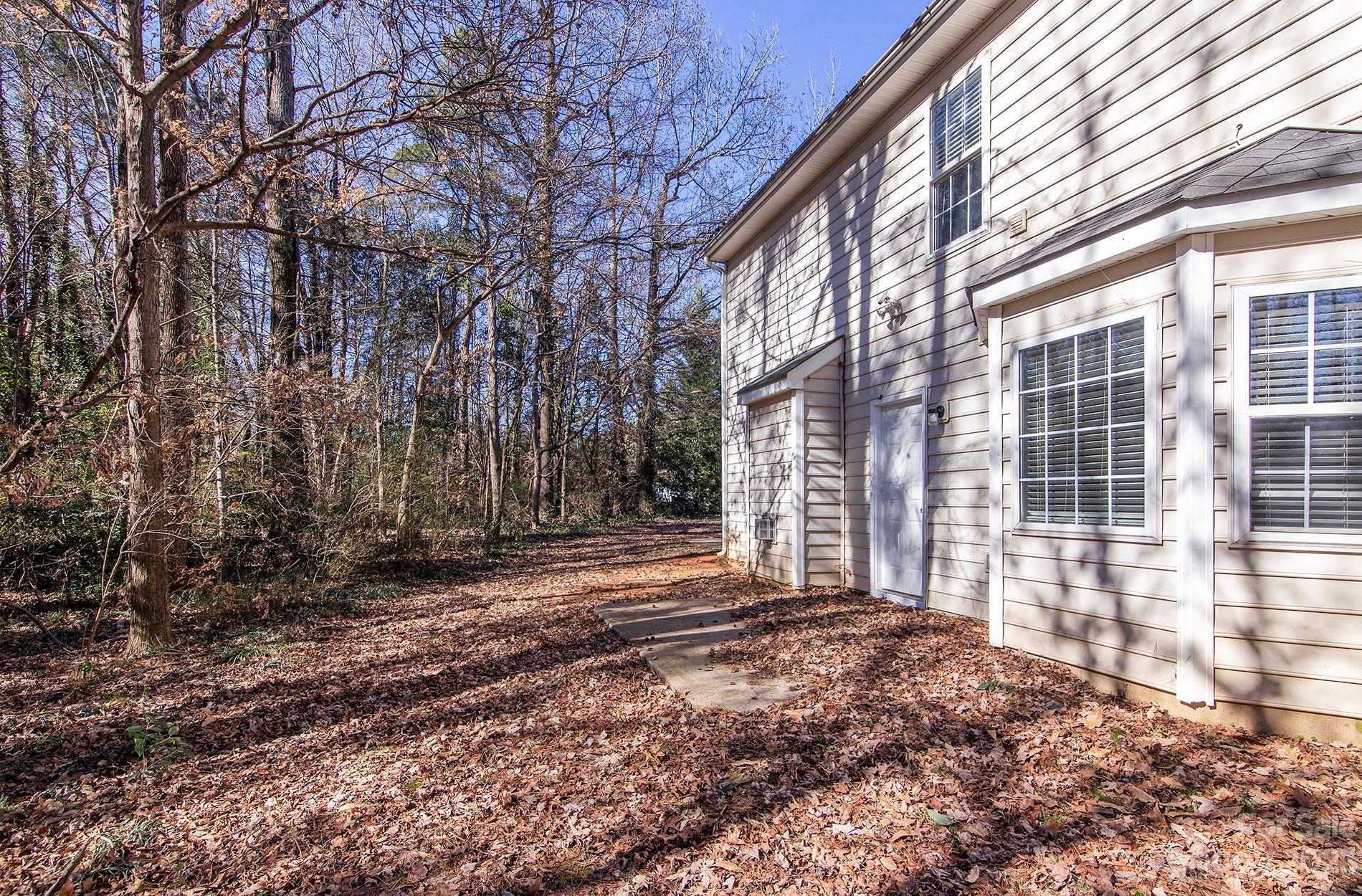 6112 Nevin Road Charlotte, NC 28262 - Photo 23 of 23 a view of a backyard with large trees