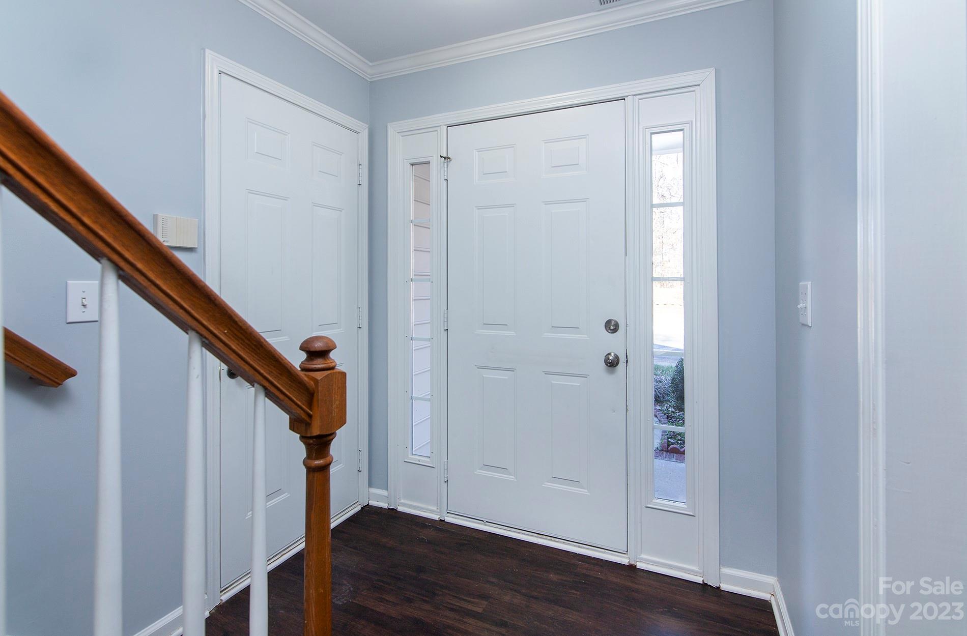 6112 Nevin Road Charlotte, NC 28262 - Photo 4 of 23 a view of entryway with stairs and wooden floor