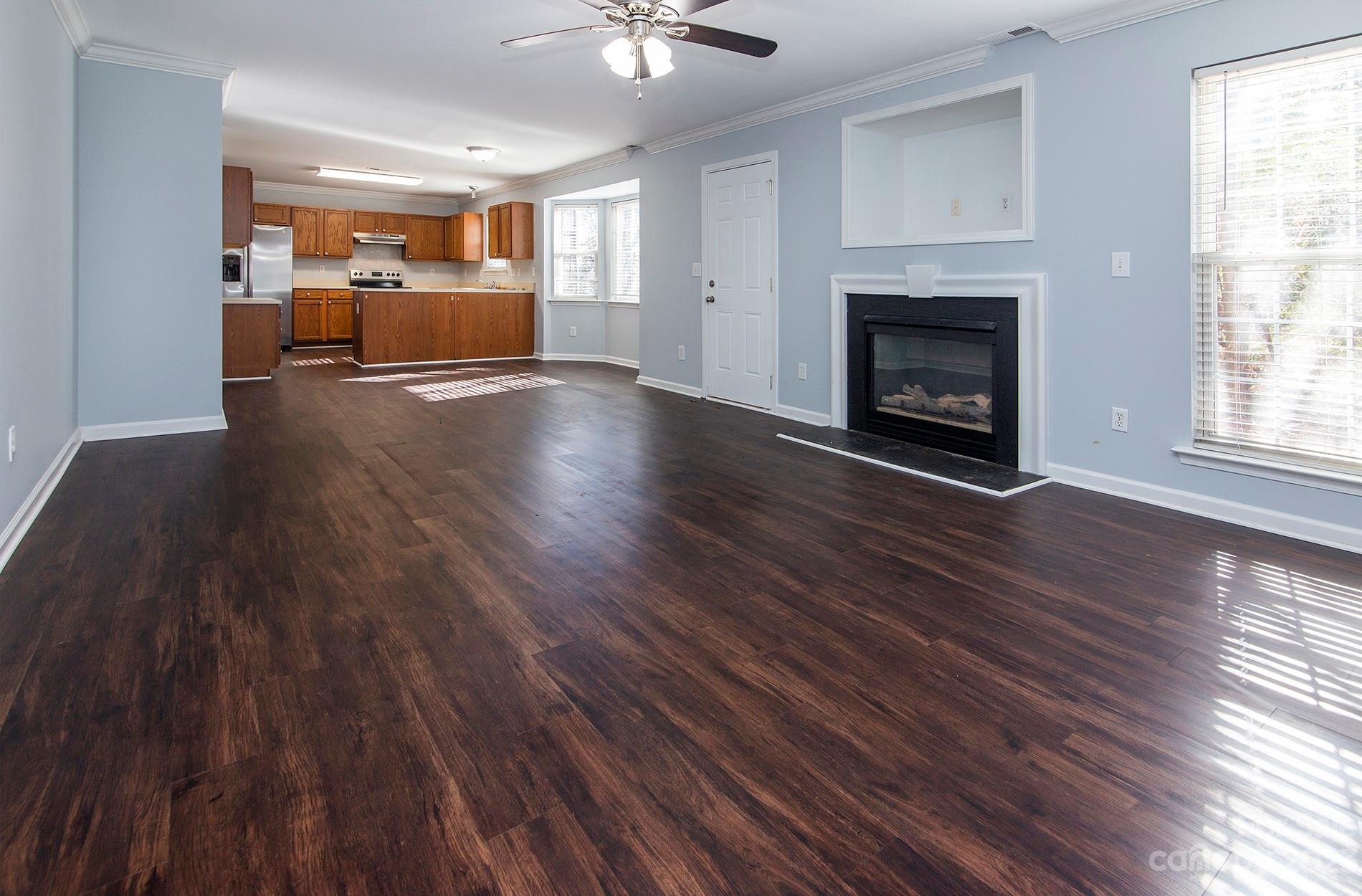 6112 Nevin Road Charlotte, NC 28262 - Photo 6 of 23 a living room with furniture and a fireplace
